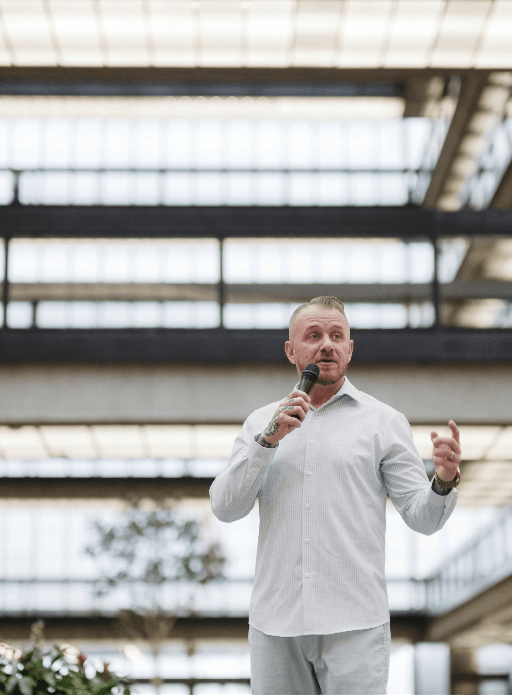 Daniel McGowan on stage at a speaking engagement